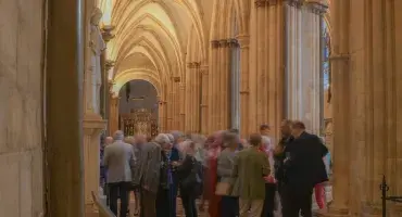A large group of people congregating in the Cathedral