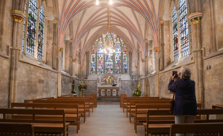 A visitor takes a photo in the Lady Chapel