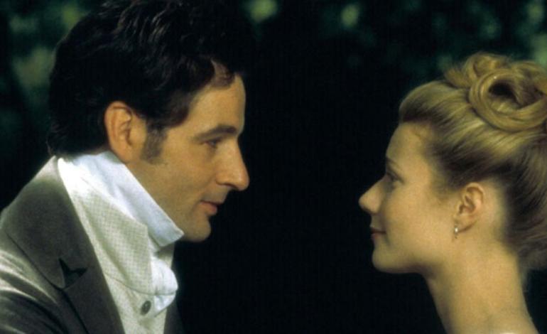 a man and a woman look at each other
