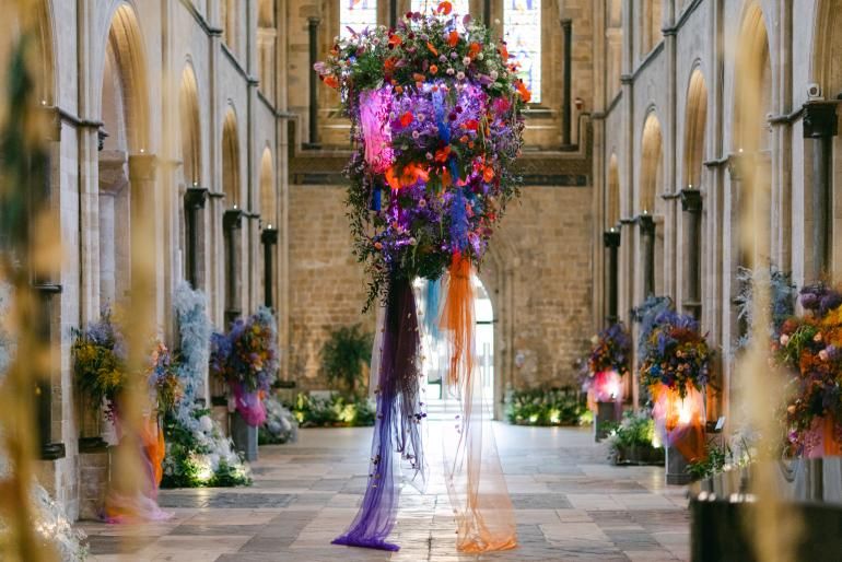 Photo credit: Helen Cawte Photography. Illuminated hanging floral installation in the nave of Chichester Cathedral during the Festival of Flowers.